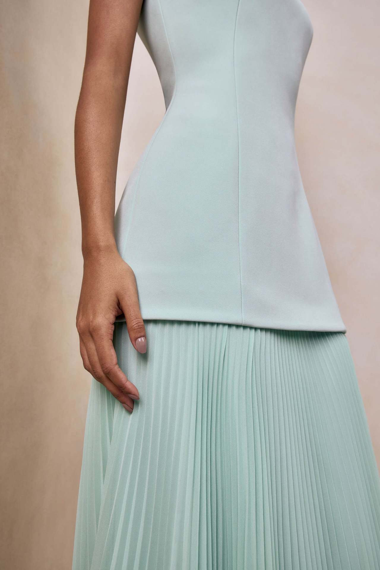 green pleated sleeveless swing dress
