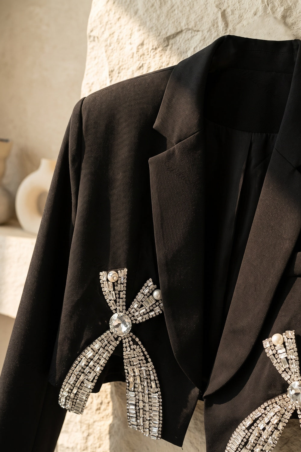 Black Woven Structured Cropped Blazer with Rhinestone Bow Embellishments black woven suiting fabric cropped blazer - product view 6