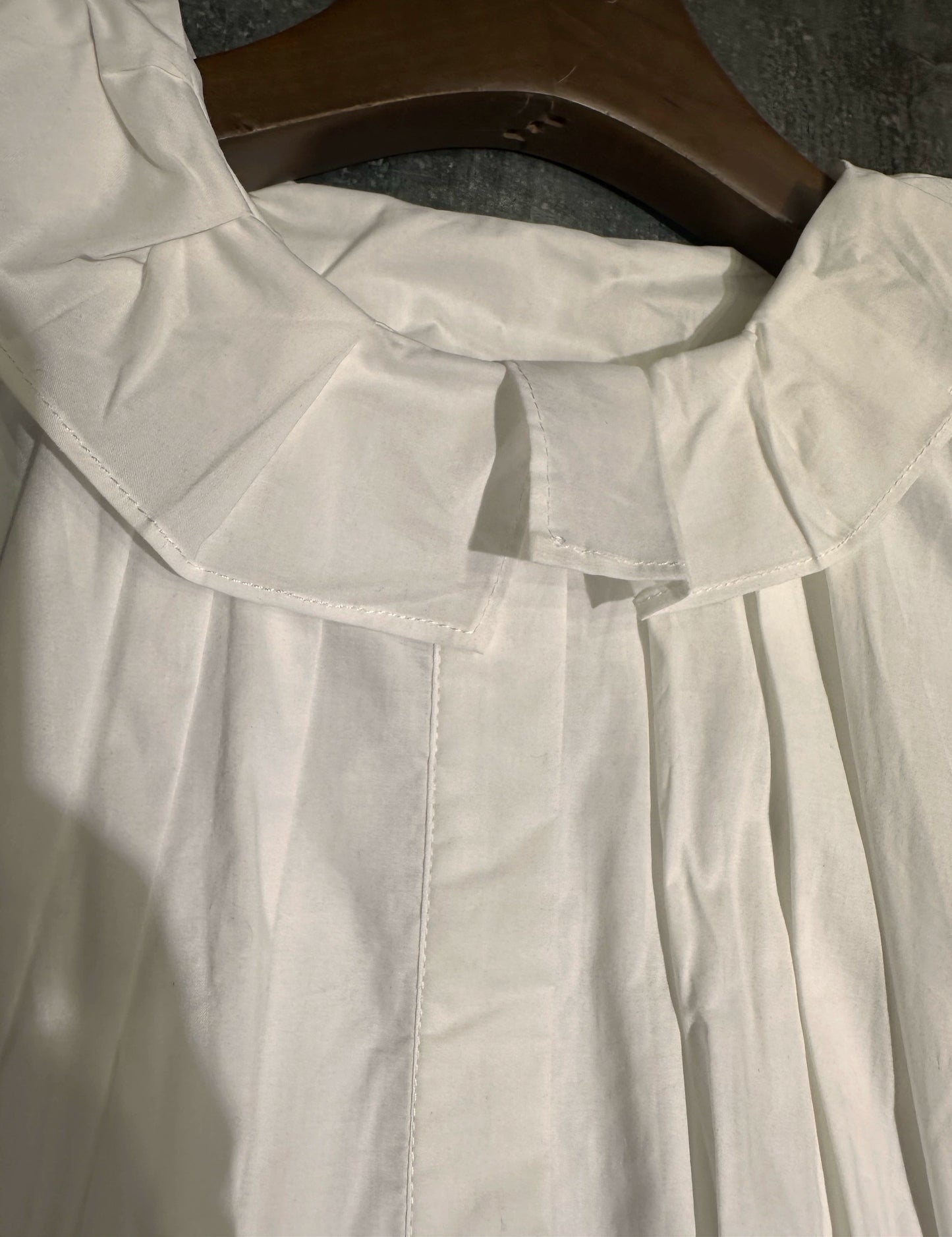 white midi dress with a crew neck and pleated lantern sleeves