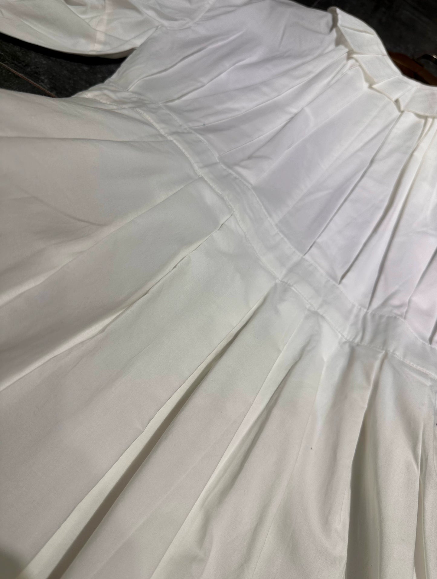 white midi dress with a crew neck and pleated lantern sleeves