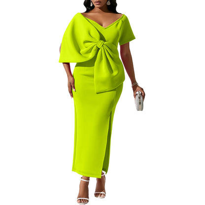 Dress With A Large Bow Slit