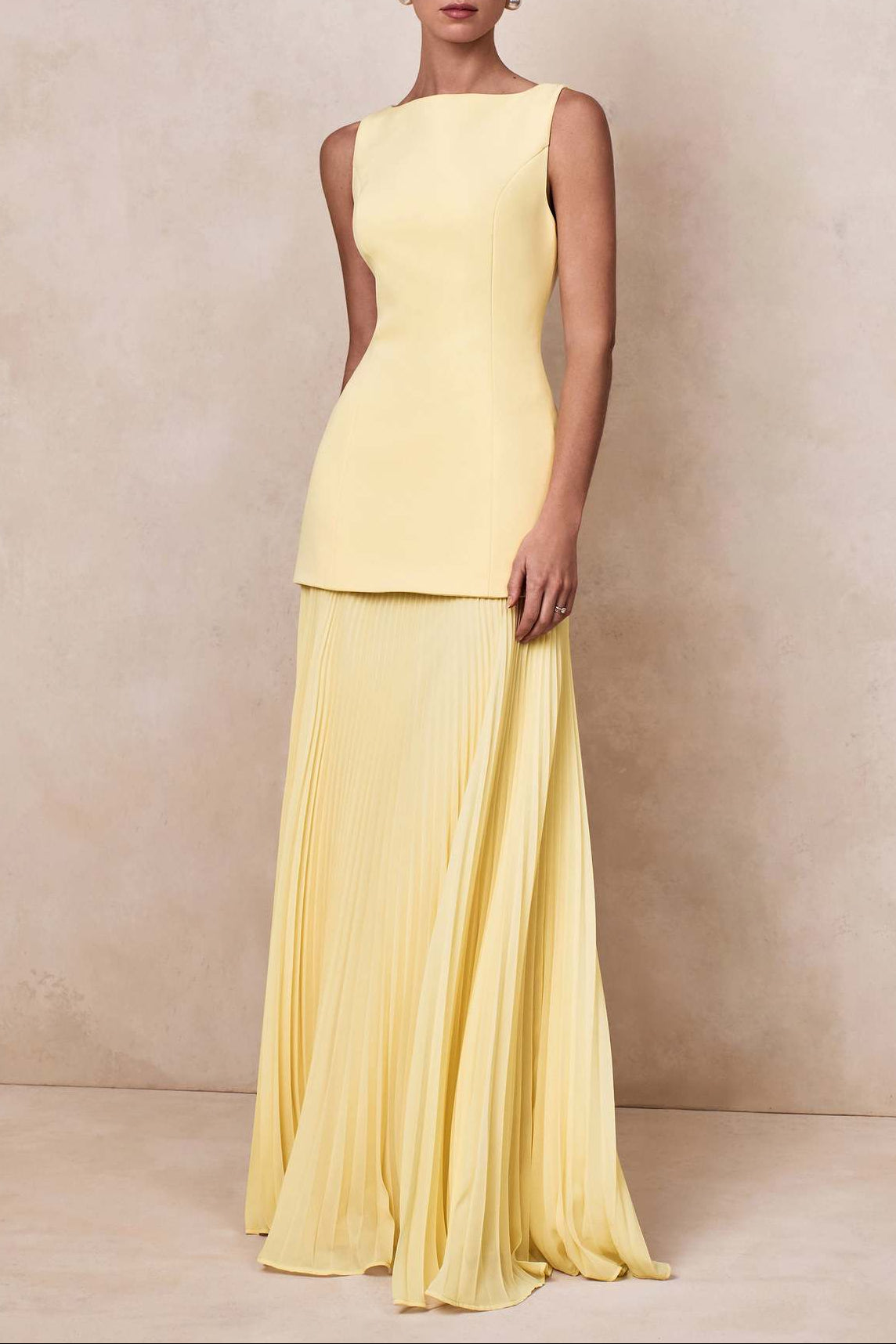 yellow pleated sleeveless swing dress